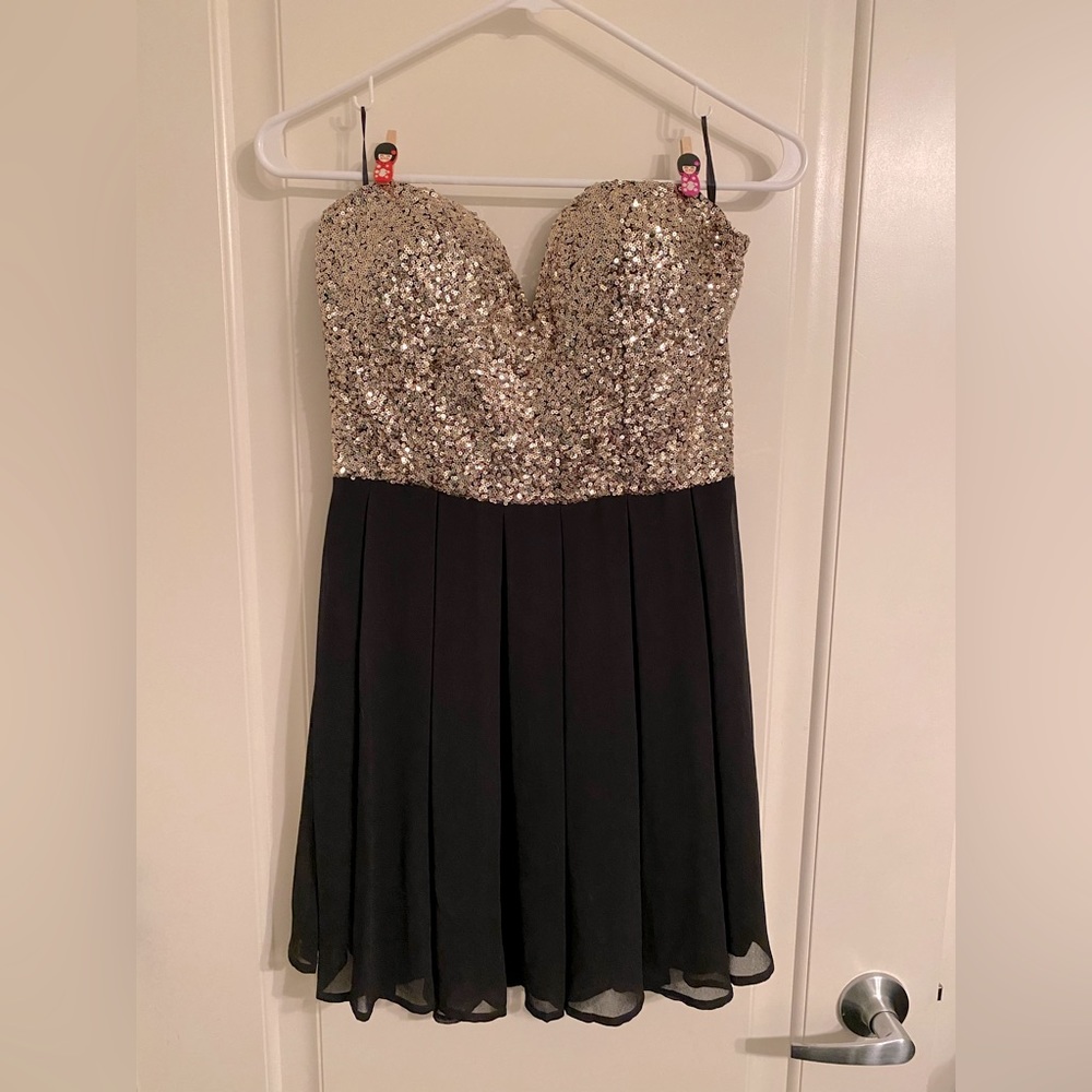 Strapless gold sequin top with black pleated skirt mini dress. Size L